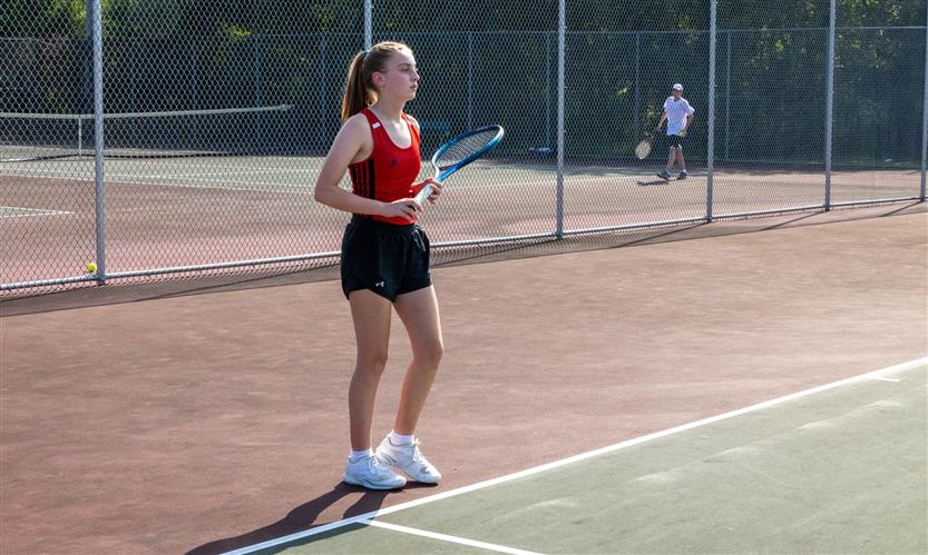 A tennis player hits the ball